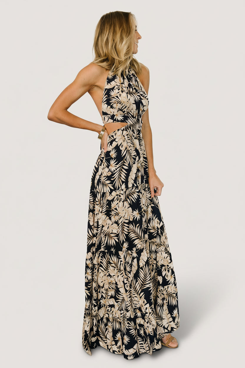 Back view of navy halter maxi showing open back with tie detail and elasticated waist for a comfortable, adjustable fit.