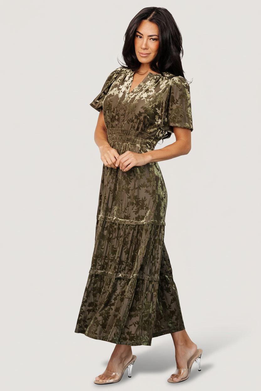 Close-up of the burnout velvet texture and smocked waistband in olive, showing fabric stretch and subtle sheen.