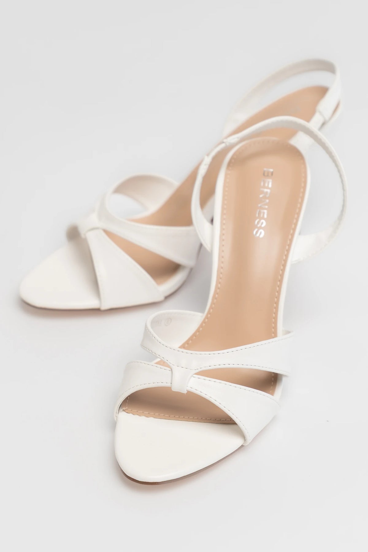 Brynn Cross Strap Slingback Heel in Ivory with open toe, overlapping front straps, slingback design, and slim high heel.