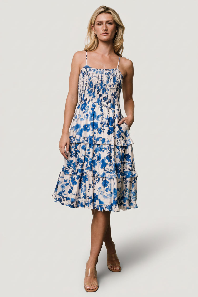 Detail image of tiered skirt and ruffled hem on Calina midi dress, showing movement and lightweight rayon-blend fabric.