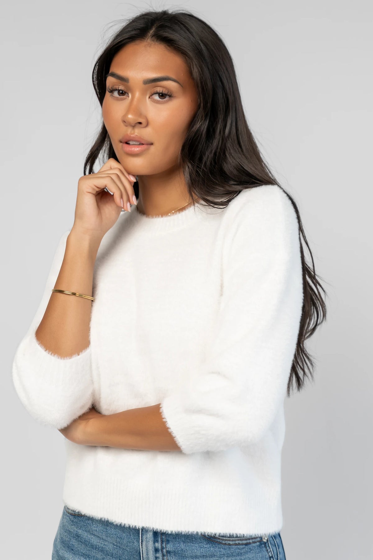 Calista Sweater Top in Off White with a round neckline, dropped shoulders, and 3/4-length sleeves.