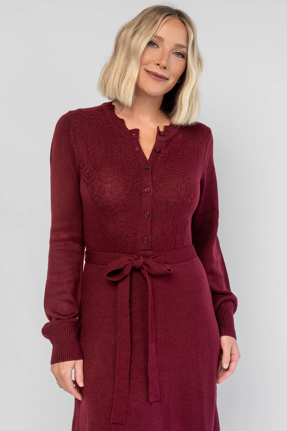 Camilla Sweater Dress in Wine with a knit button-down bodice, removable waist belt, and a flowing lined skirt.