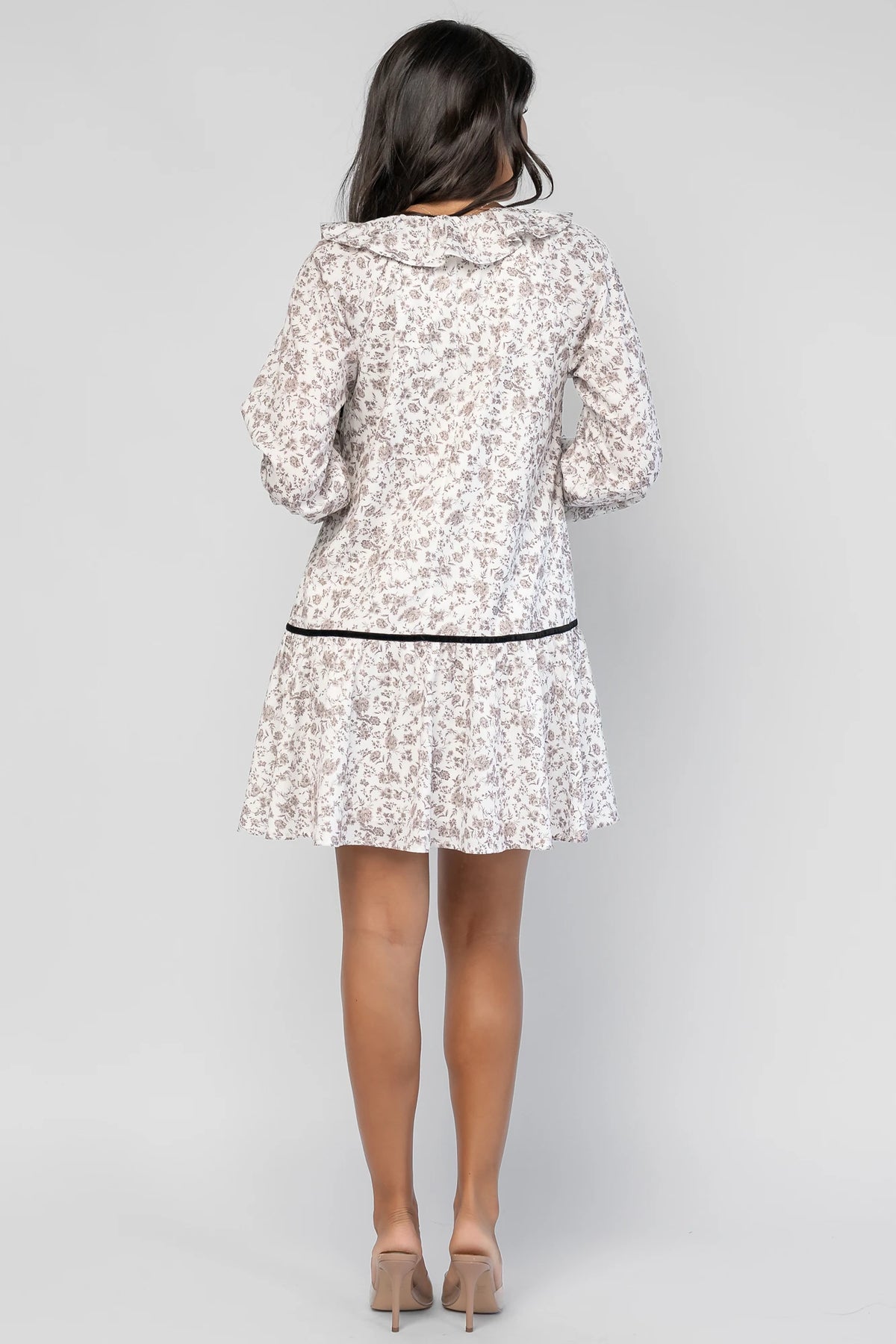 Caprice Bow Front Short Dress in Ivory Floral with V-neckline, ruffled trim, black velvet bow, and long sleeves.