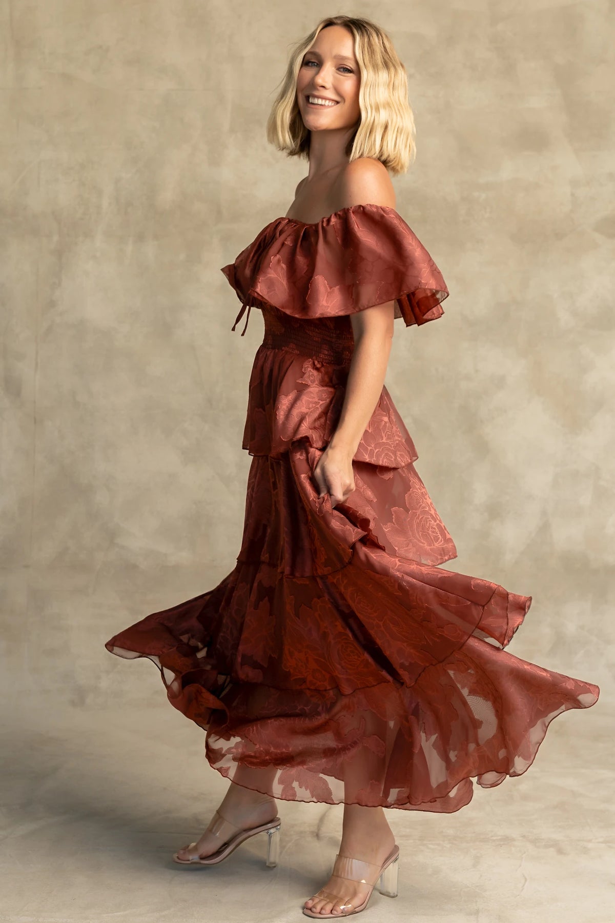 Carina Off Shoulder Maxi Dress in Marsala with ruffle neckline, smocked waist, and four-tiered chiffon skirt.