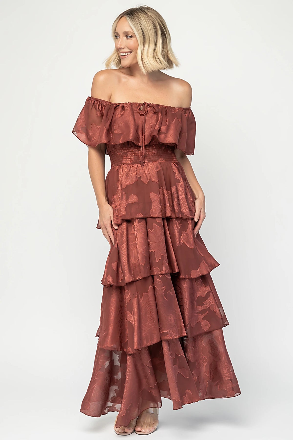 Carina Off Shoulder Maxi Dress in Marsala with ruffle neckline, smocked waist, and four-tiered chiffon skirt.