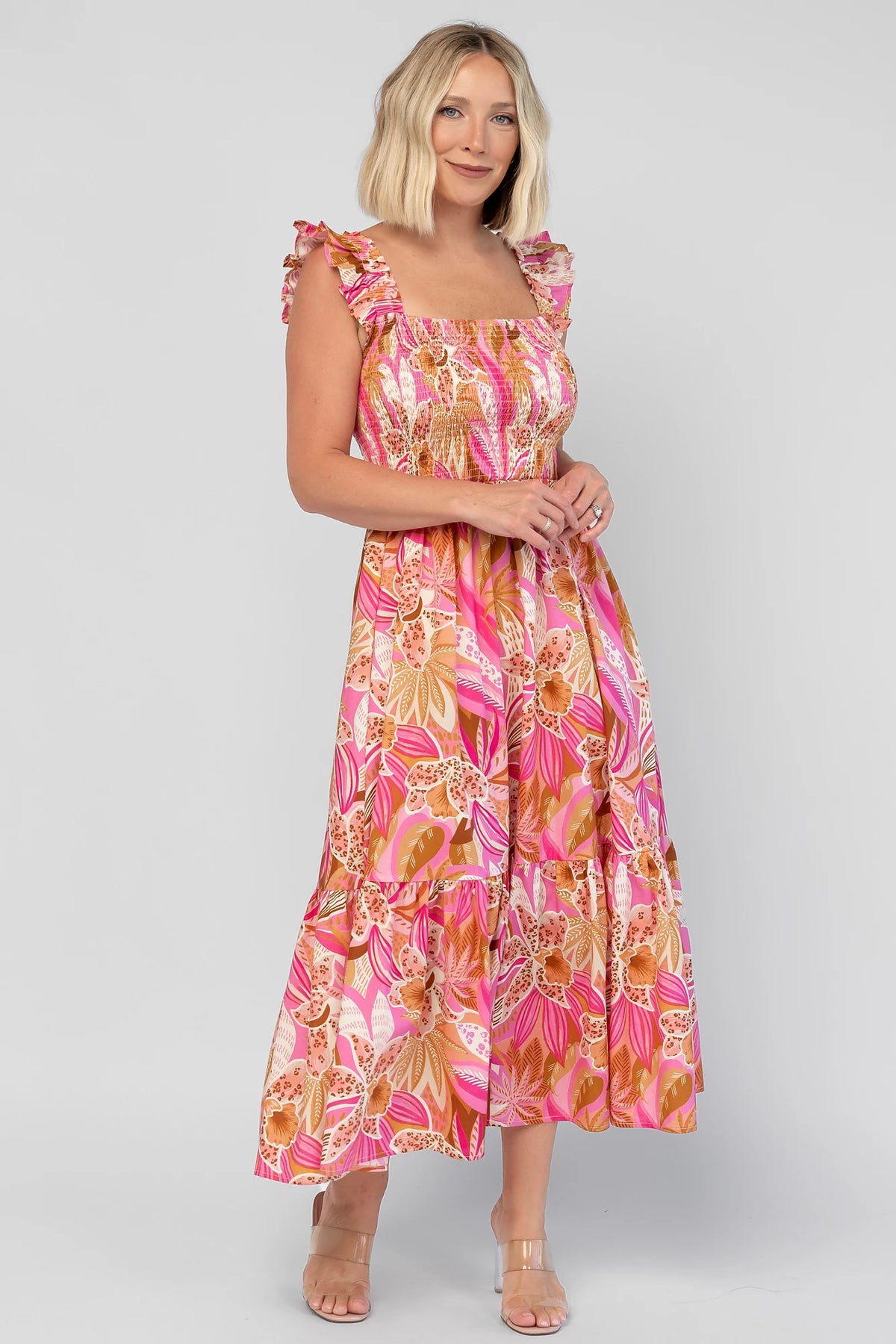 Carla Smocked Dress in Pink Multi with a smocked bodice, square neckline, ruffle straps, and a flowy midi skirt.