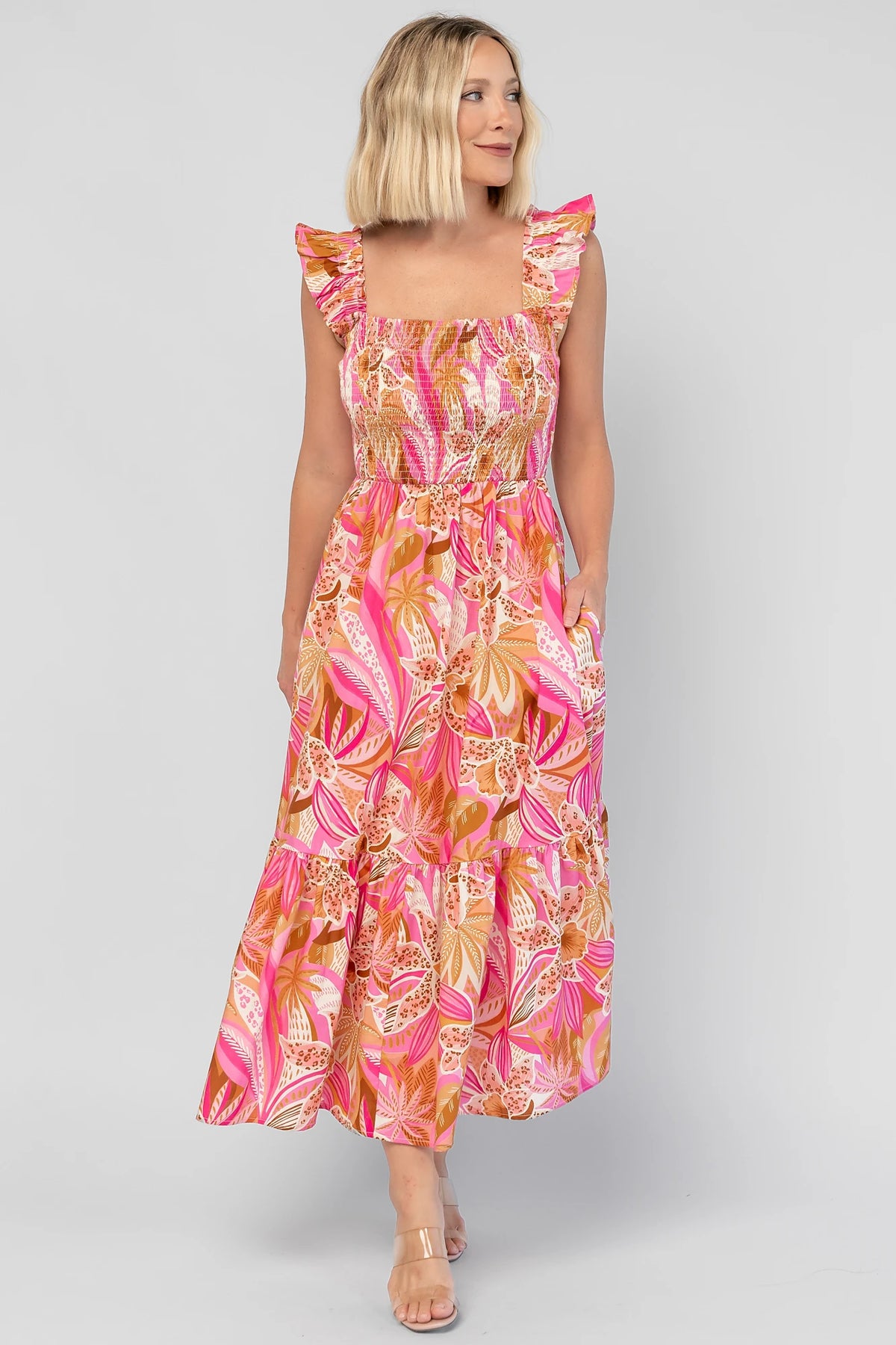 Carla Smocked Dress in Pink Multi with a smocked bodice, square neckline, ruffle straps, and a flowy midi skirt.