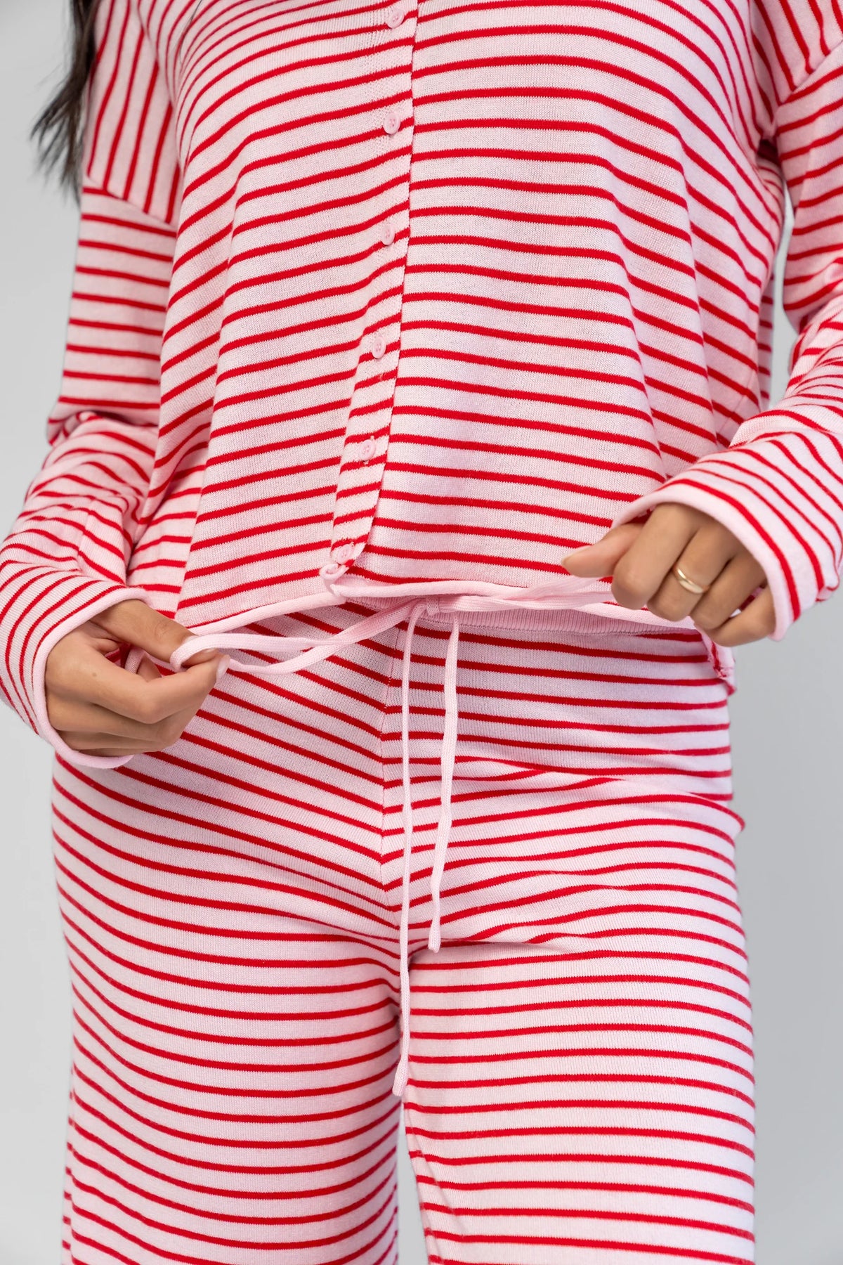 Charlene Cozy Stripe Lounge Set in Pink + Red with striped pattern and coordinating top and pants.