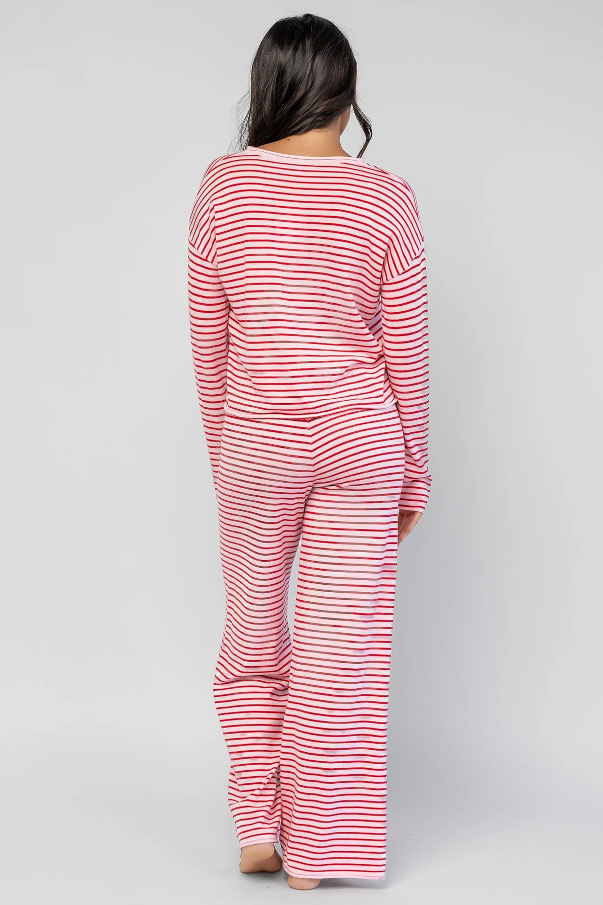 Charlene Cozy Stripe Lounge Set in Pink + Red with striped pattern and coordinating top and pants.