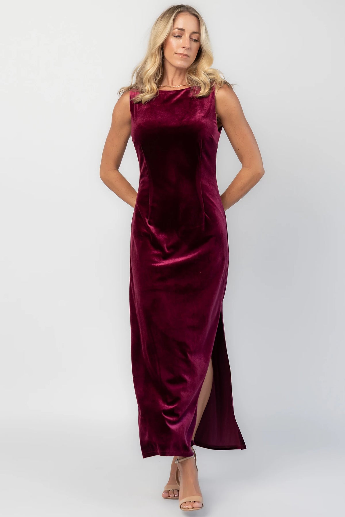 Charley Velvet Maxi Dress in Wine with an elegant boat neckline, sleeveless design, and a figure-skimming column silhouette.