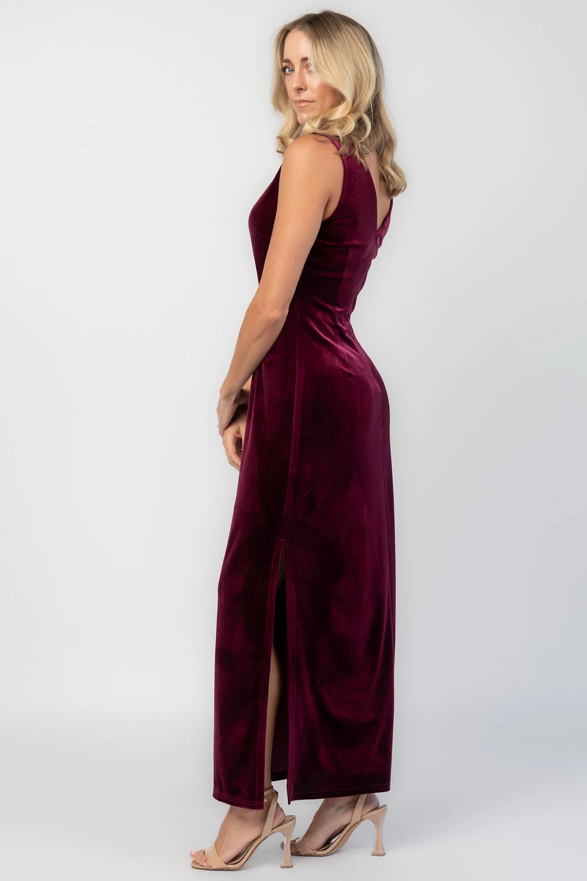 Charley Velvet Maxi Dress in Wine with an elegant boat neckline, sleeveless design, and a figure-skimming column silhouette.