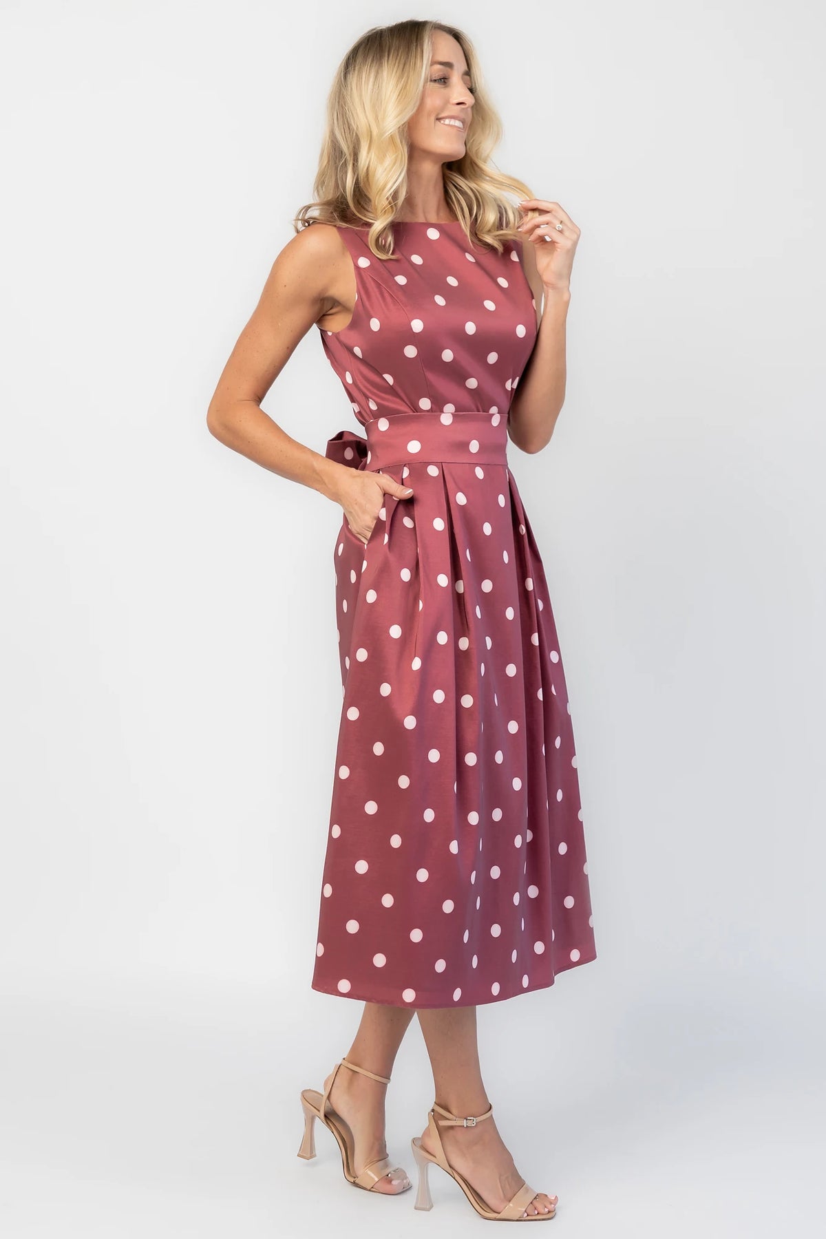 Chiara Midi Dress in Wine + Pink Dot with a boat neckline, pleated full skirt, and a fitted sleeveless bodice.