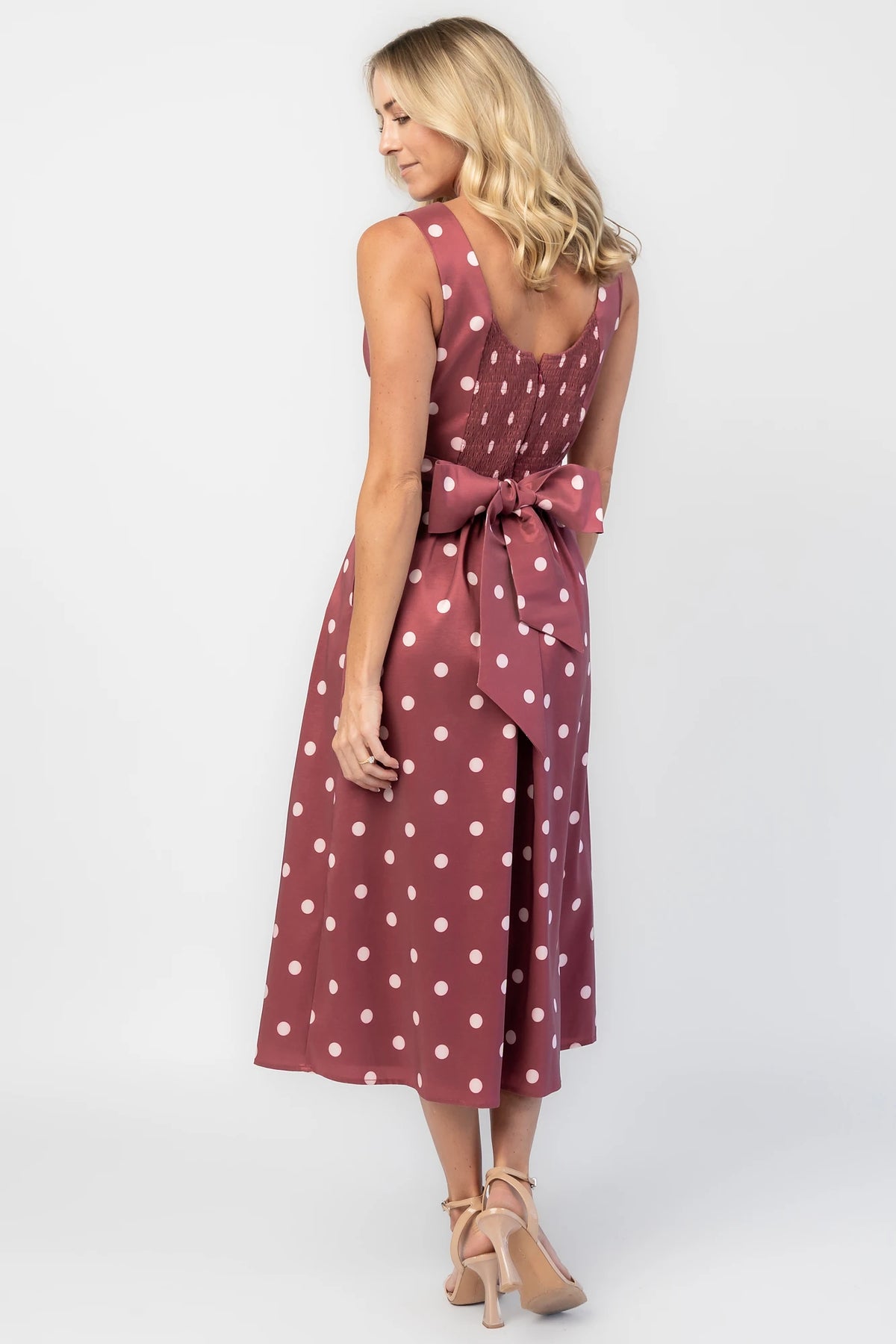 Chiara Midi Dress in Wine + Pink Dot with a boat neckline, pleated full skirt, and a fitted sleeveless bodice.