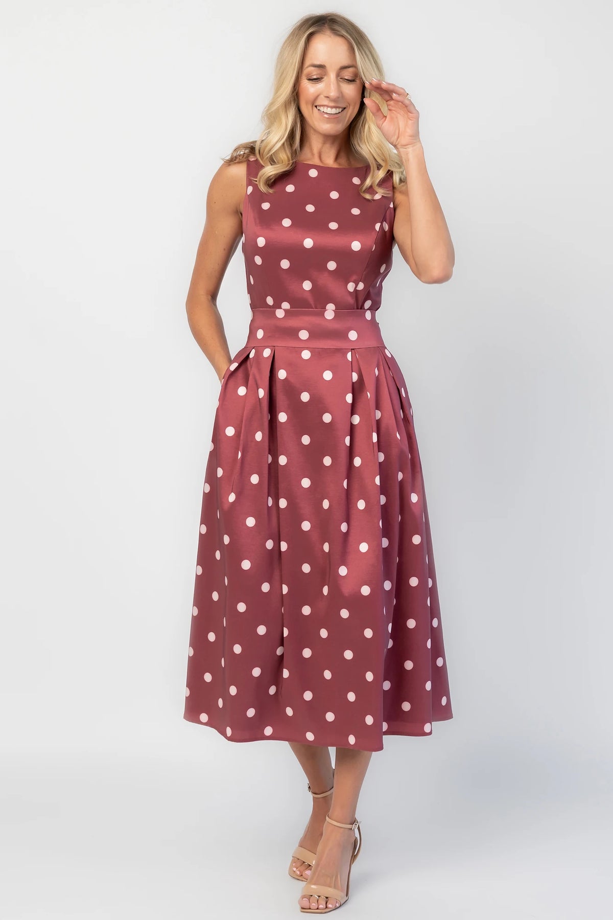 Chiara Midi Dress in Wine + Pink Dot with a boat neckline, pleated full skirt, and a fitted sleeveless bodice.