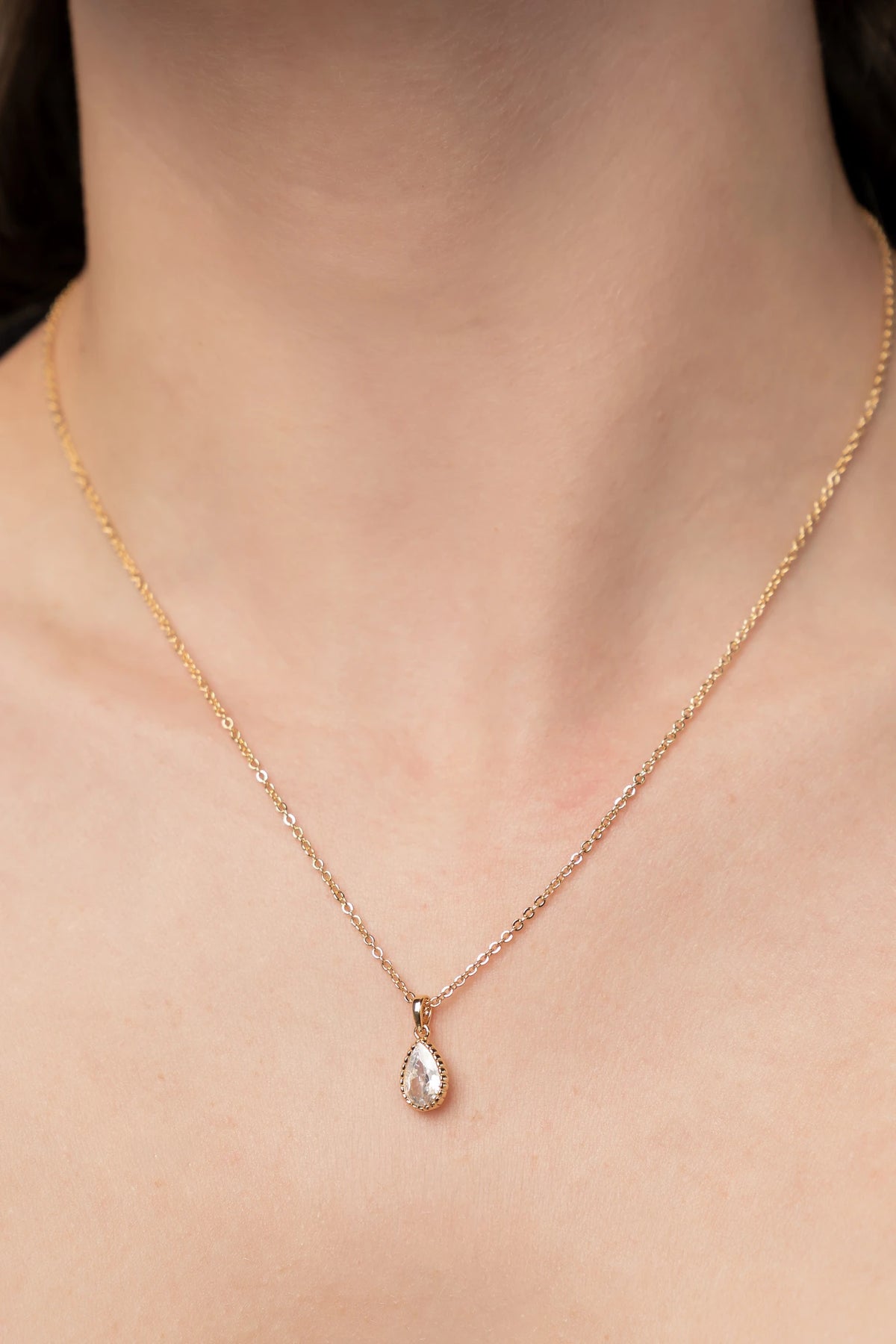 Christy Teardrop Pendant Necklace in Gold with sparkling teardrop-cut cubic zirconia pendant and delicate gold-tone chain.