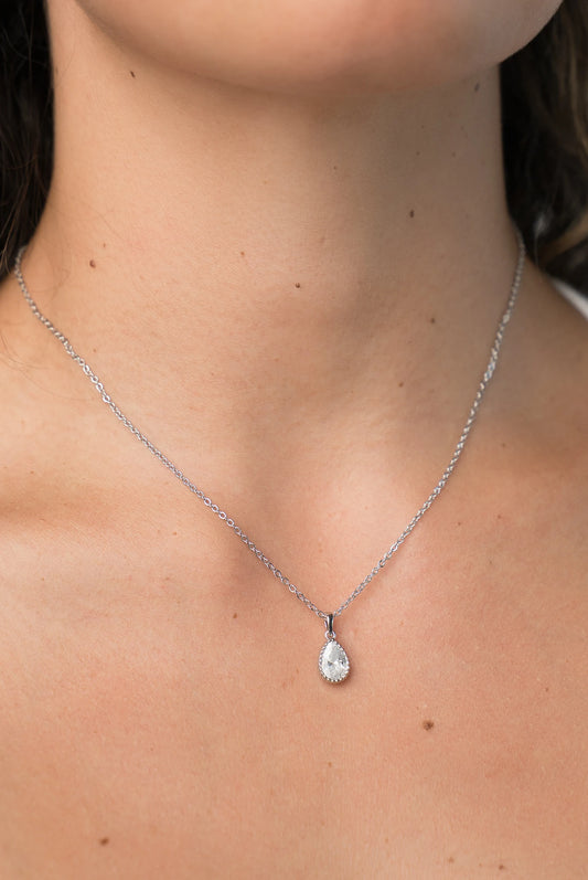 Christy Teardrop Pendant Necklace in Silver with teardrop cubic zirconia pendant and delicate chain.