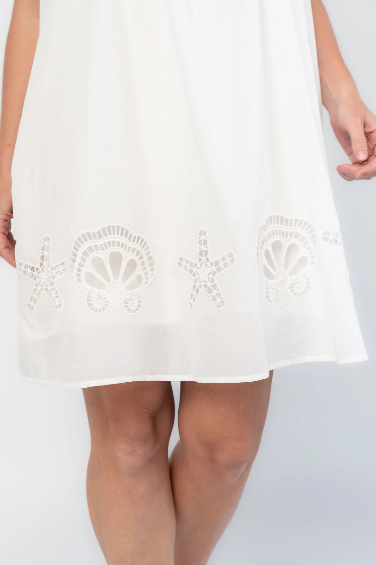 Citrus Short Dress in Off White with scoop neckline, shell and starfish cutouts, and relaxed silhouette.
