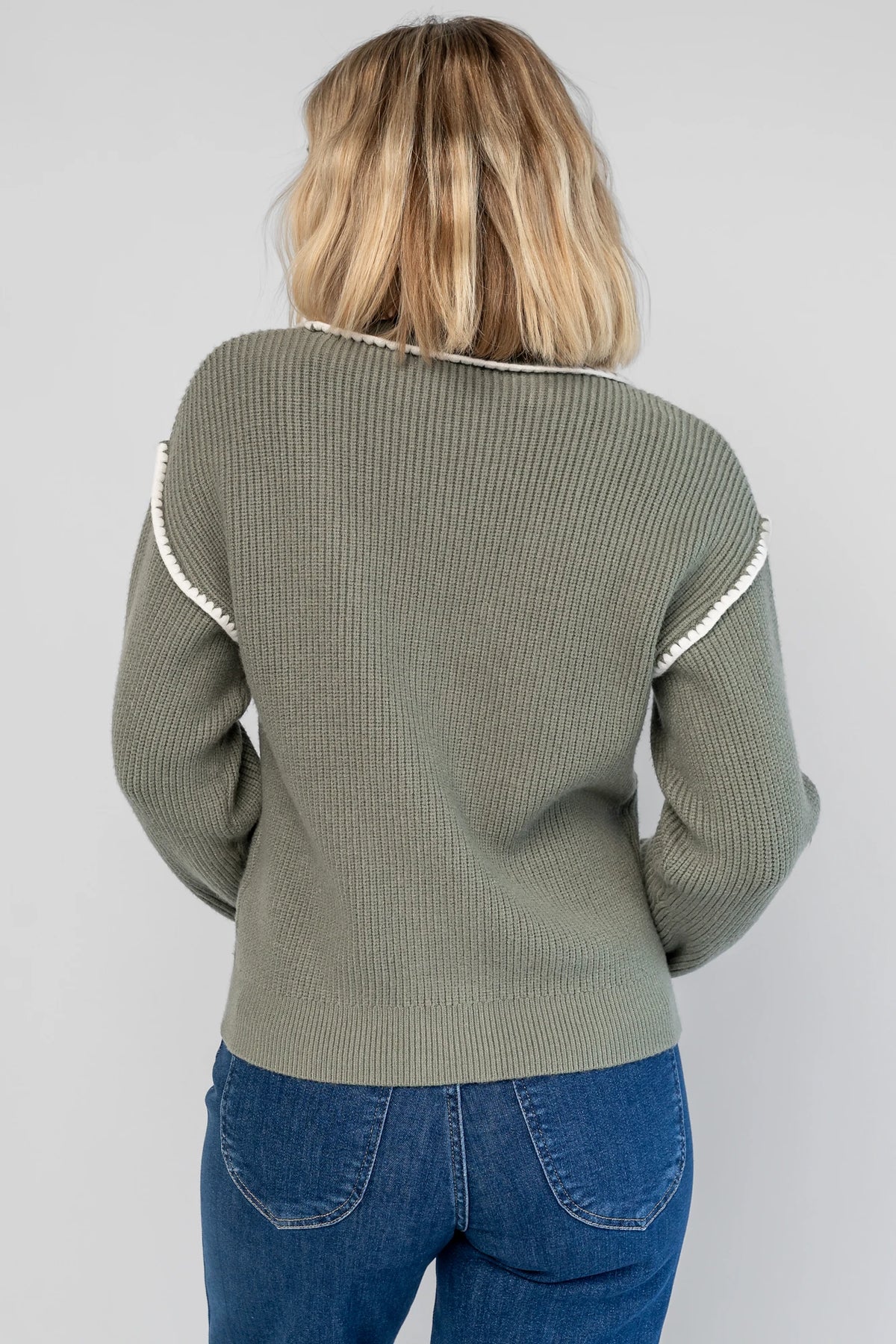 Clarke Button Up Cardigan in Dusty Sage with tortoise-colored buttons, white piping details, and a button-front design.