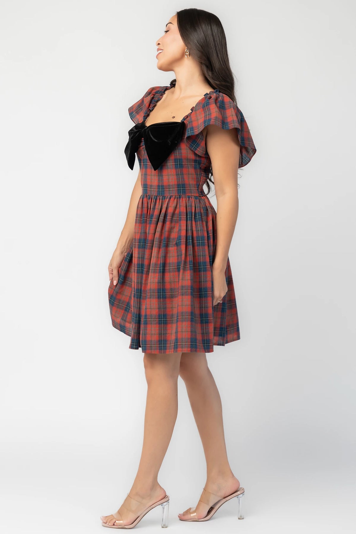 Claudine Short Dress in Plaid Multi with black velvet bow, square neckline, flutter sleeves, and gathered skirt.