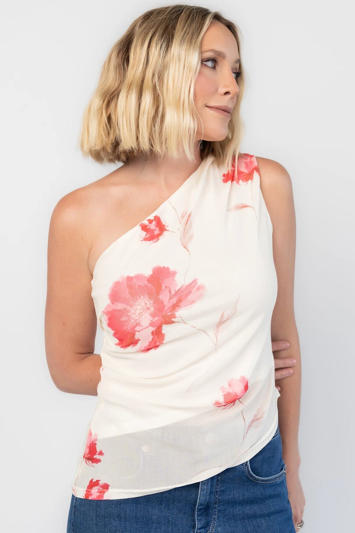 Cleo Mesh Top in Cream Floral with one-shoulder neckline, ruched bodice, and fitted silhouette.