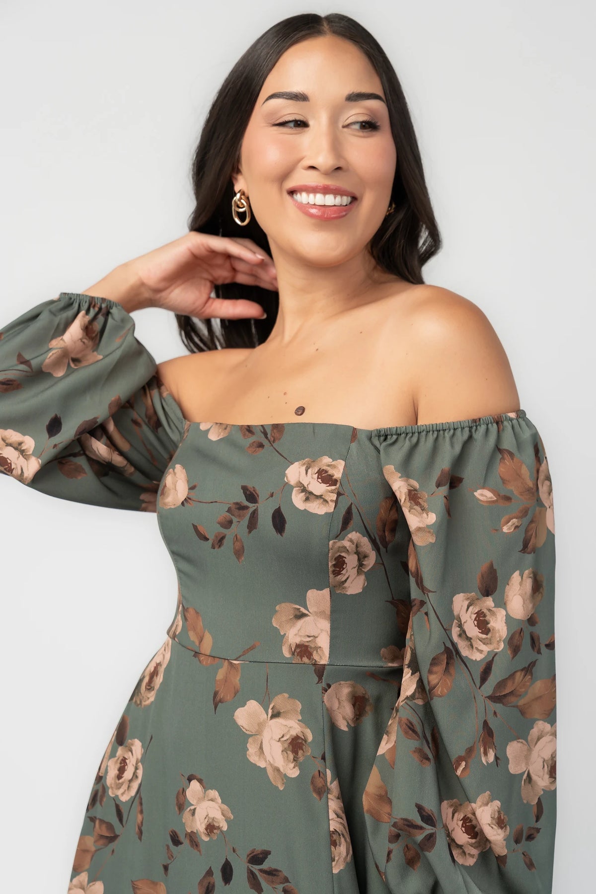 Cordelia Off Shoulder Maxi Dress in Dark Teal Floral with smocked back, long sleeves, and leg slit.
