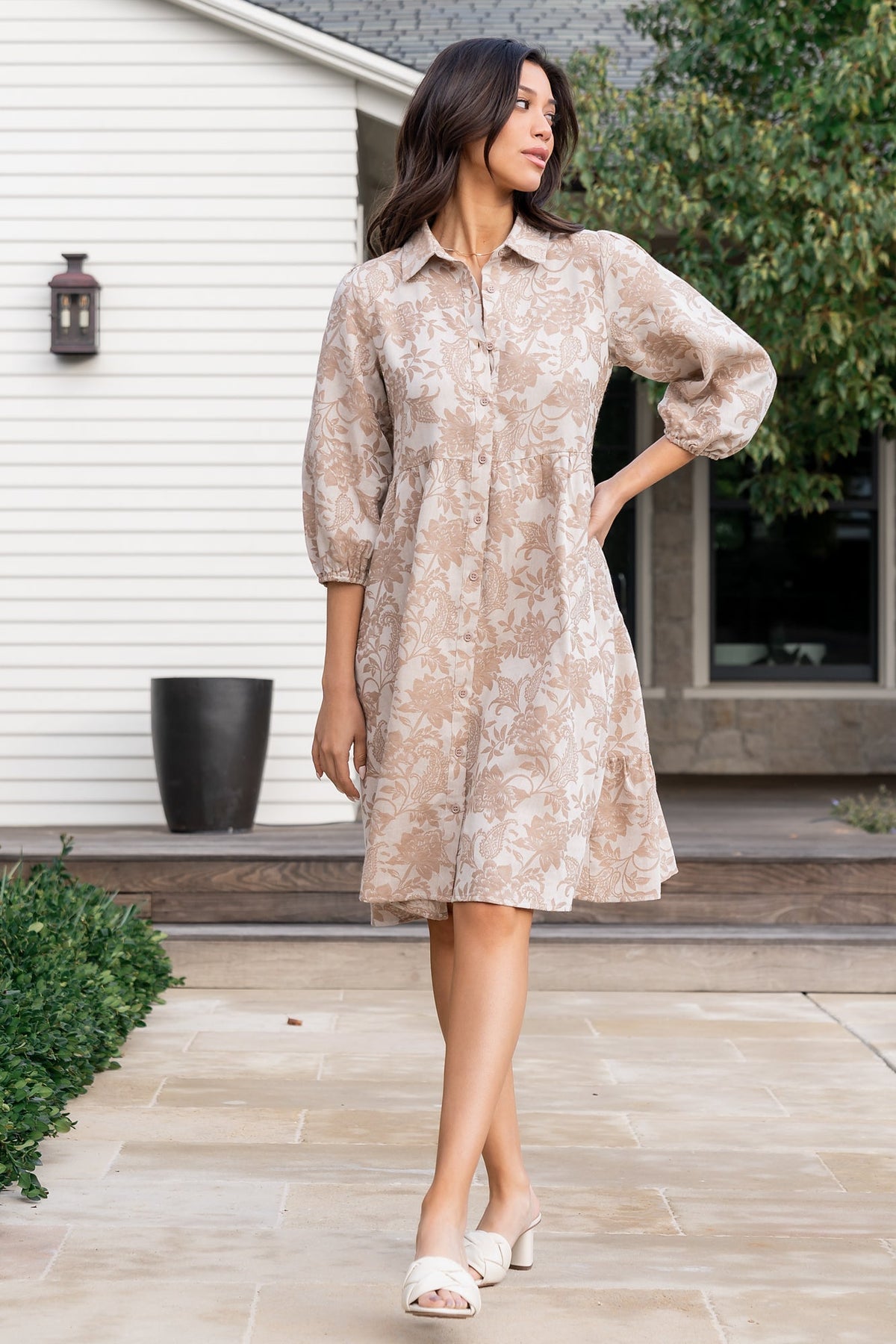 Side view of Dakota Babydoll Dress revealing roomy side pockets and the dress's relaxed silhouette on model.