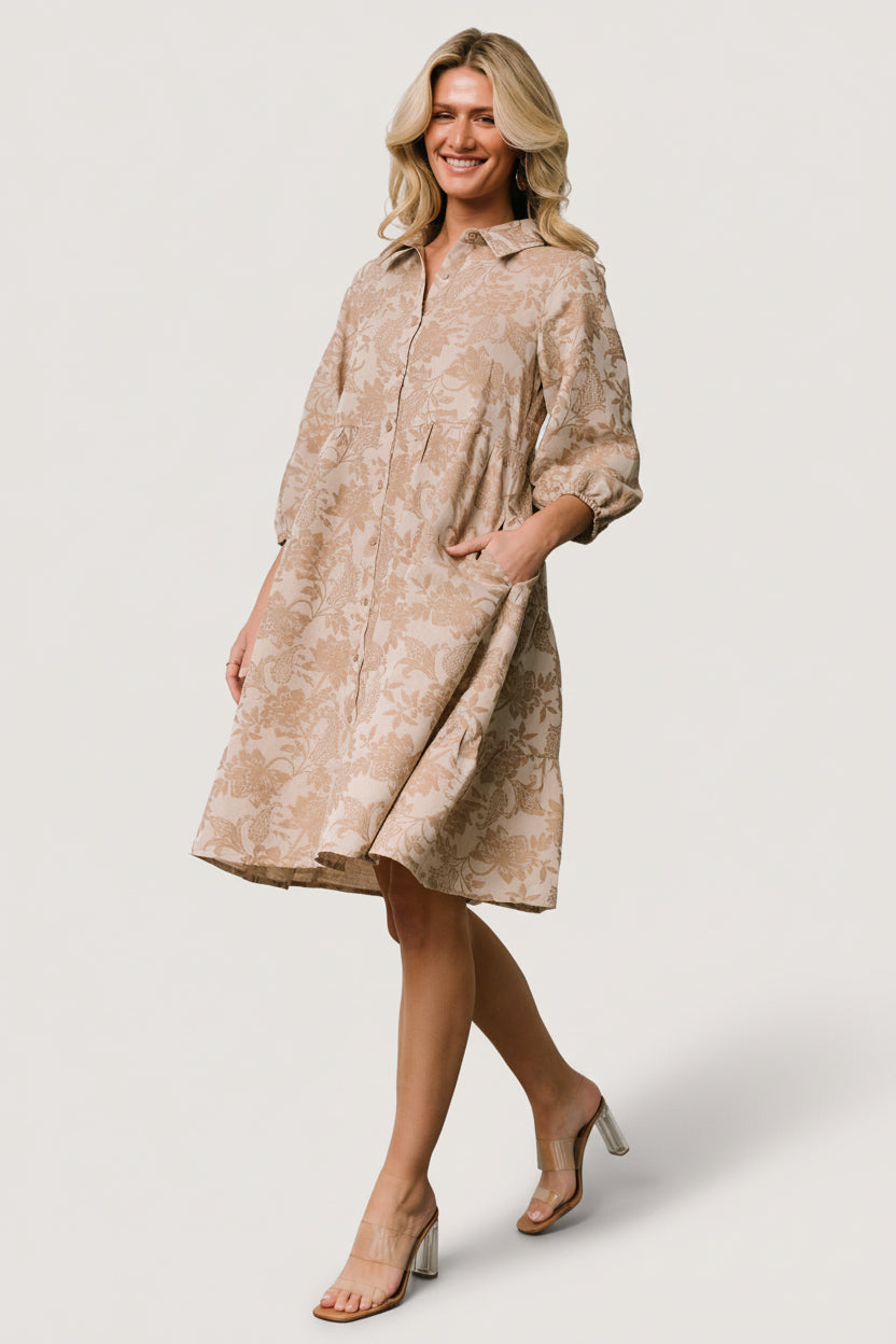 Close-up of Dakota Babydoll Dress fabric and botanical print, showing button-down front and collar details.