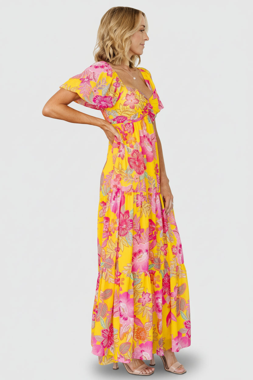 Styled look of Darla maxi dress with accessories, illustrating versatile wear from daytime brunch to evening summer parties.