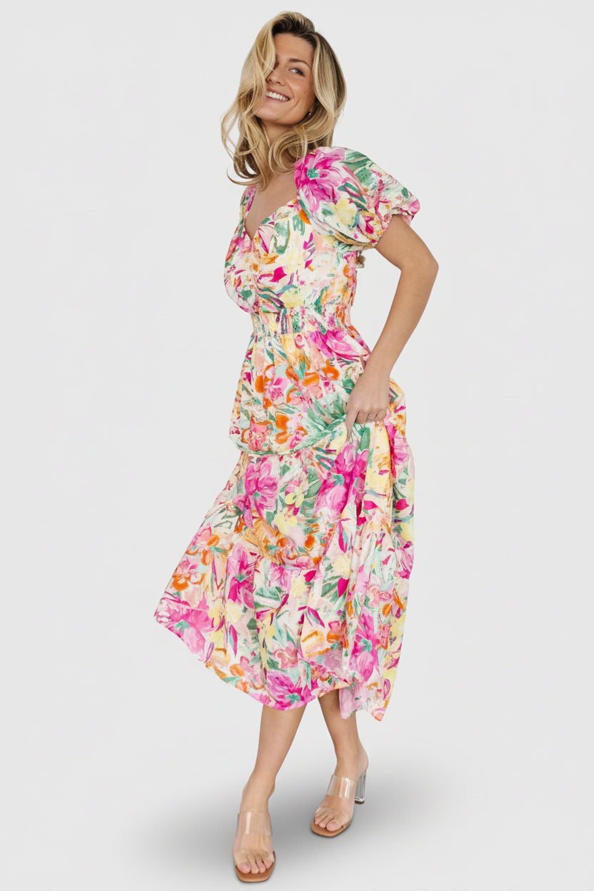 Side view of the midi dress showing sleeve shape and elastic cuff detail, plus the tiered hem and how the lining falls to the knees.