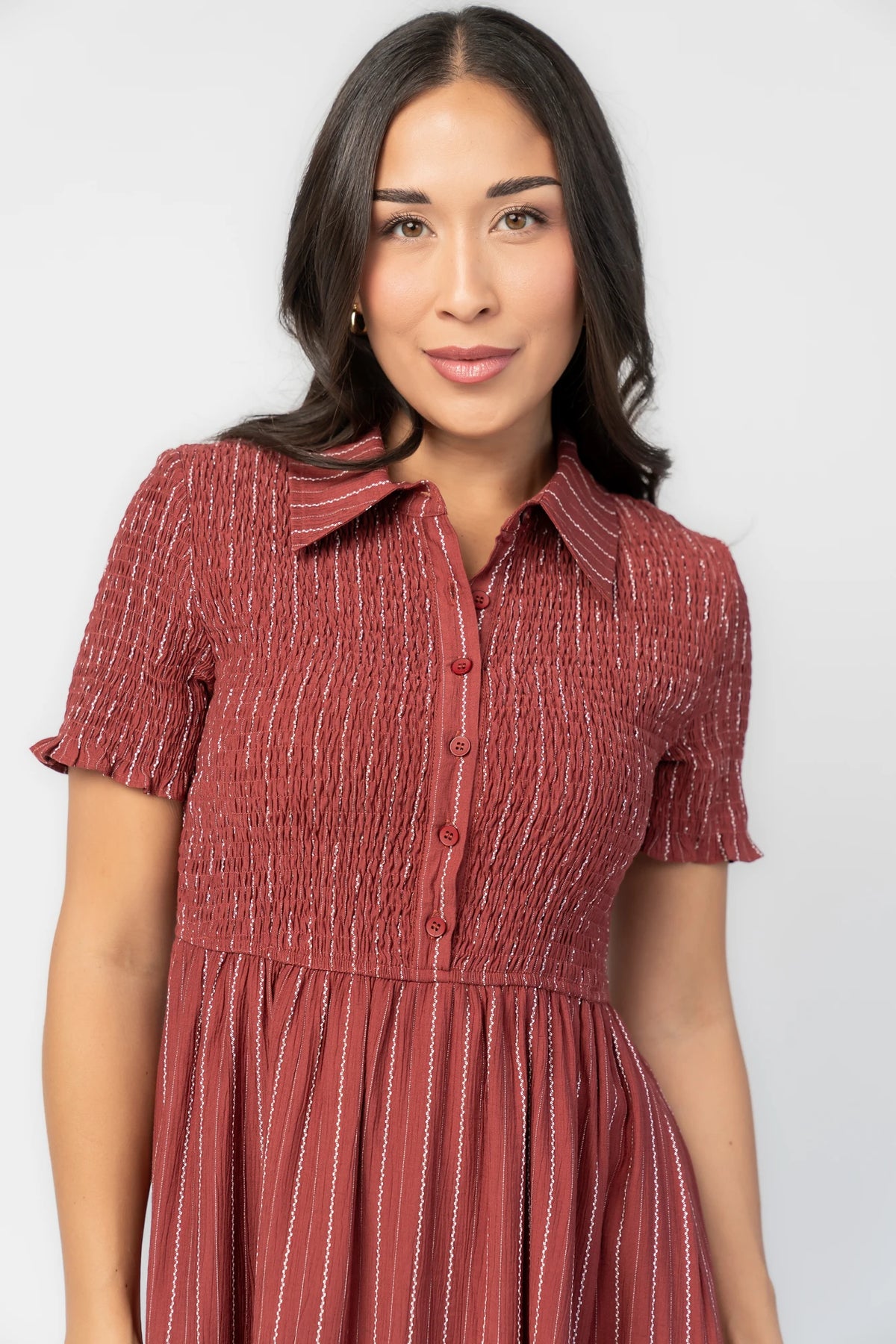 Dottie Striped Midi Dress in Light Burgundy with white vertical stripes, collared neckline, button front, and A-line skirt.