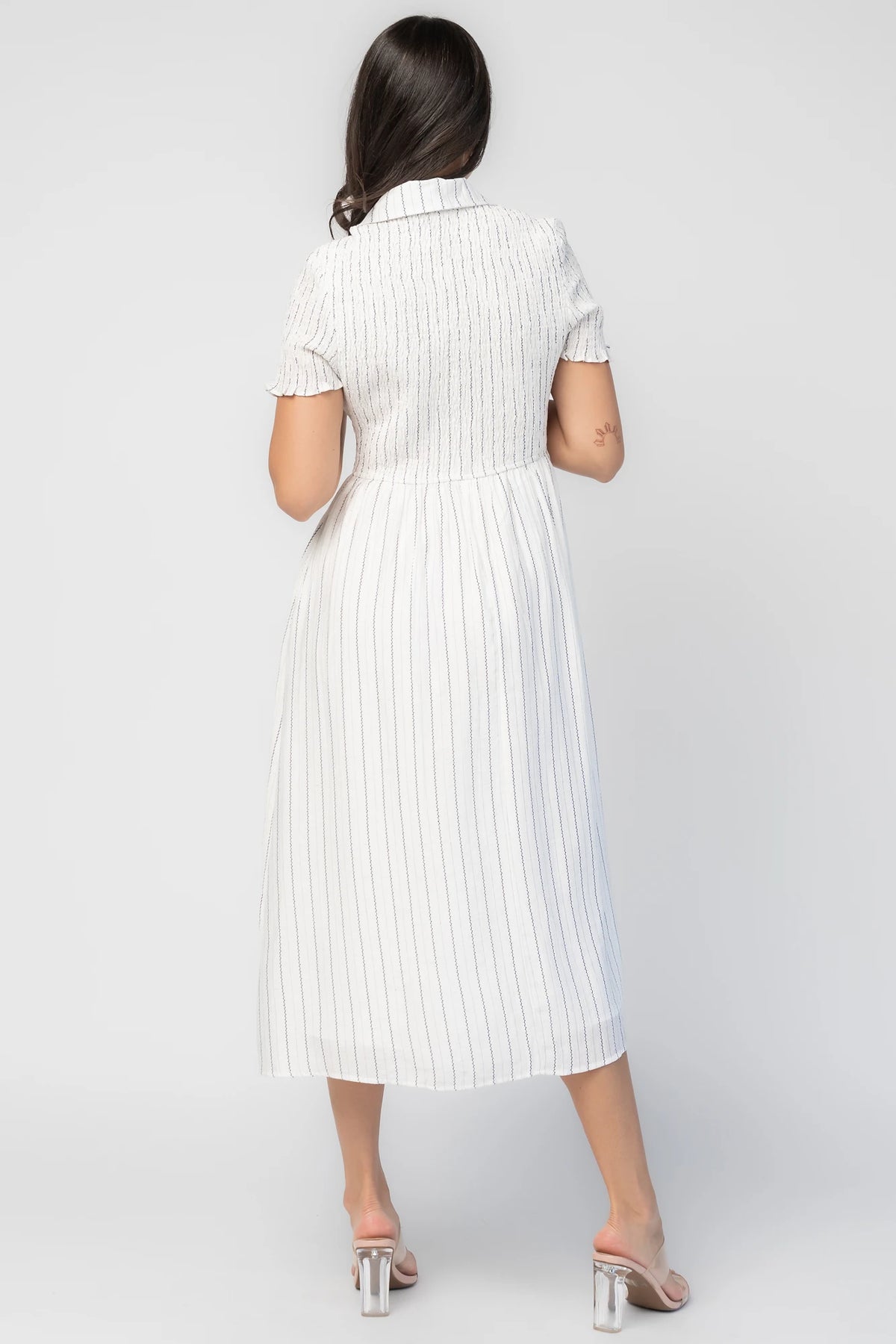Dottie Striped Midi Dress in Off White with navy vertical stripes, collared neckline, button front, and A-line skirt.