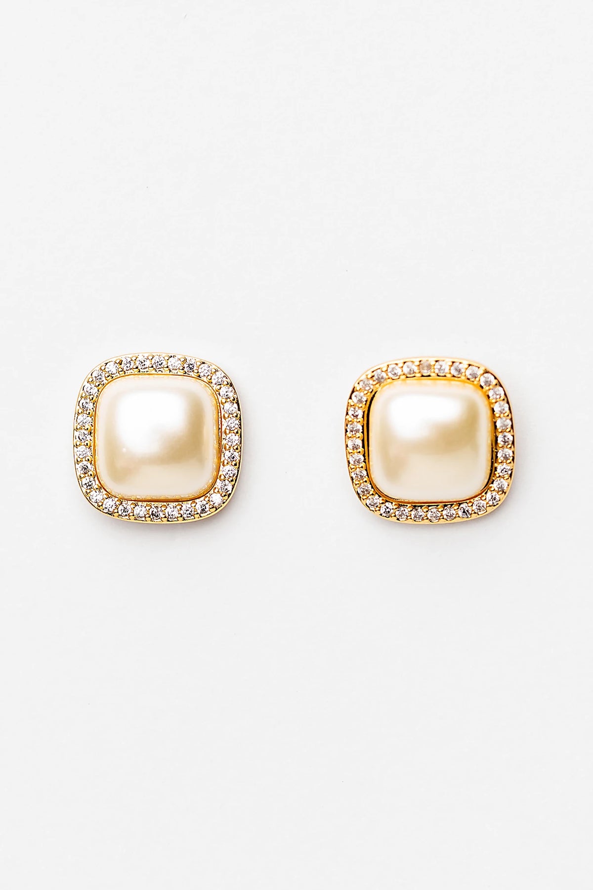 Elianna Pearl Stud Earrings in Gold with square pearl centers, clear stone borders, and polished gold-tone finish.