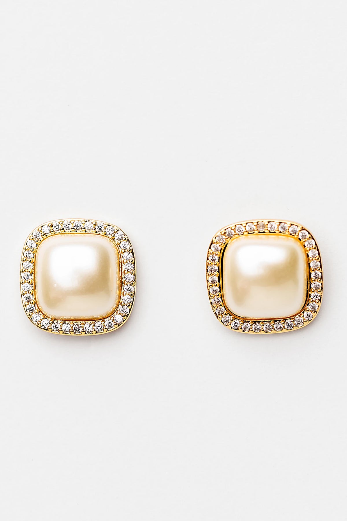 Elianna Pearl Stud Earrings in Gold with square pearl centers, clear stone borders, and polished gold-tone finish.