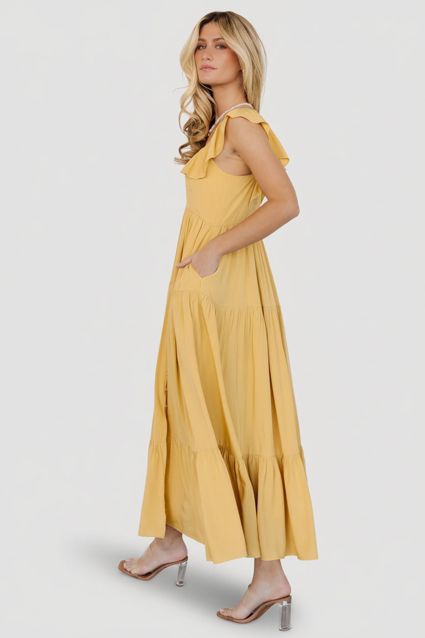 Detail shot of ruffle sleeve and hem with close view of fabric weave and fully lined skirt edge for a finished look.