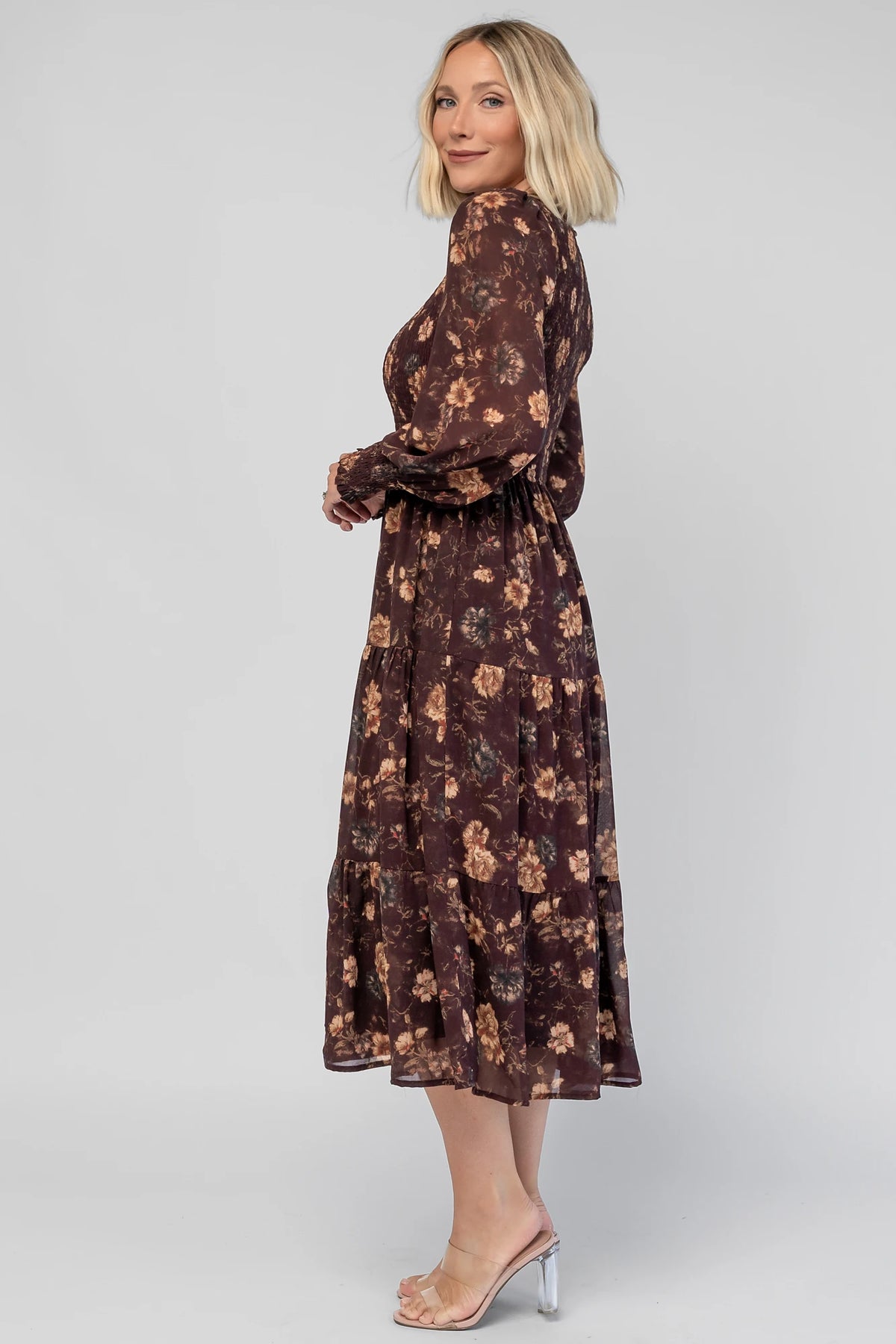 Evelyn Smocked Midi Dress in Dark Clove Floral with a smocked bodice, smocked cuffs, and a tiered midi skirt.