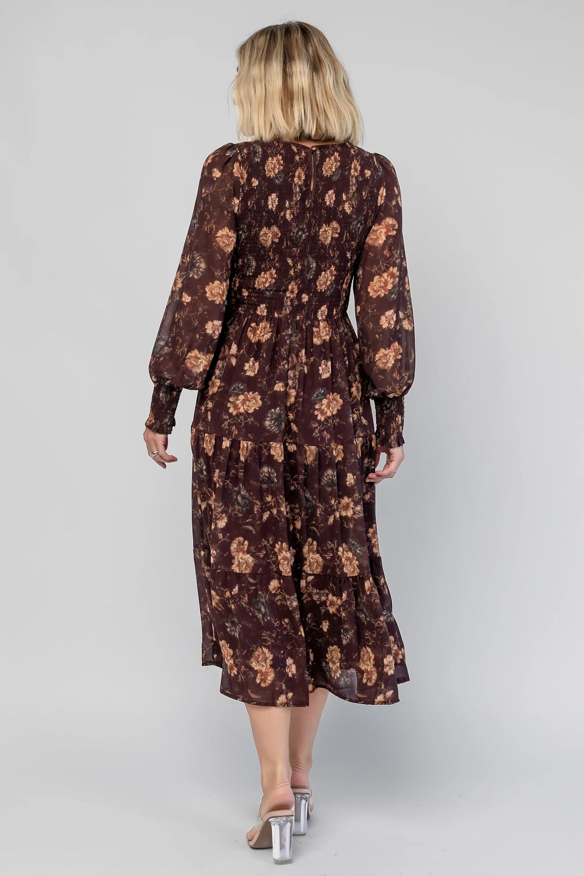 Evelyn Smocked Midi Dress in Dark Clove Floral with a smocked bodice, smocked cuffs, and a tiered midi skirt.