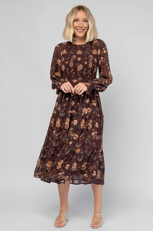 Evelyn Smocked Midi Dress in Dark Clove Floral with a smocked bodice, smocked cuffs, and a tiered midi skirt.