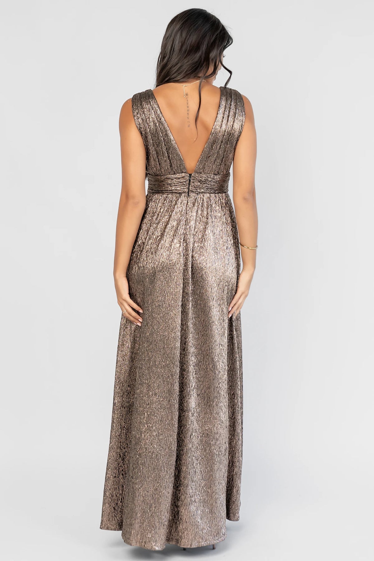 Fiora Maxi Dress in Dark Bronze with a plunging V-neckline, tank sleeves, an underbust panel, and a left leg slit.