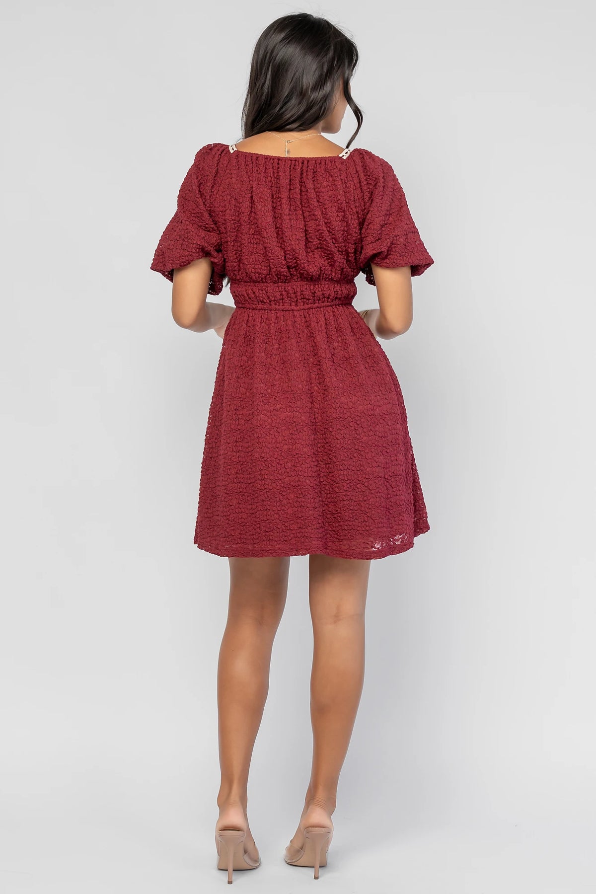 Gwyneth Short Dress in Burgundy with textured floral lace, scoop neckline, cream lace piping, and elastic sleeve cuffs.