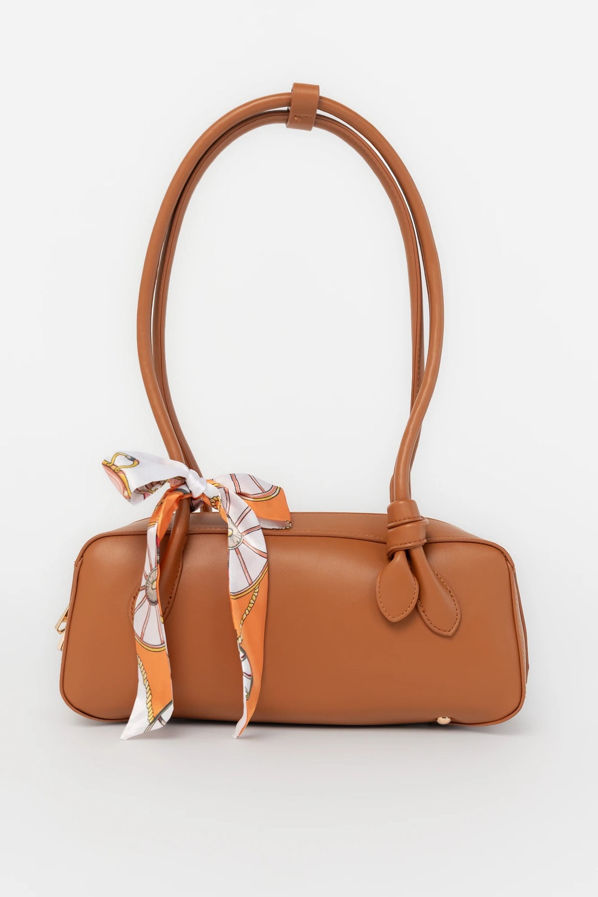 Harmony Mini Shoulder Bag in Camel with gold zipper hardware, removable bow, shoulder strap, and interior pockets.