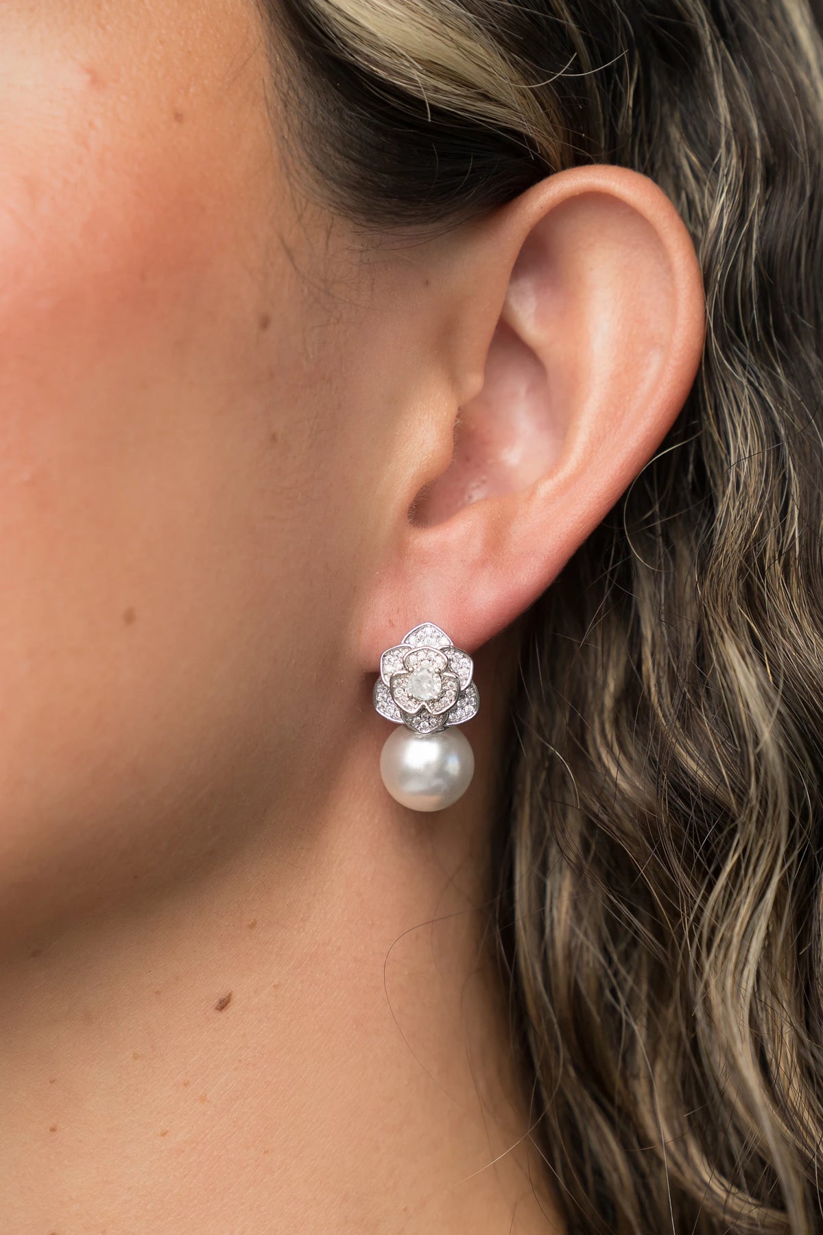 Helena Floral Pearl Drop Earrings in Silver with floral cubic zirconia studs and faux pearl drop.