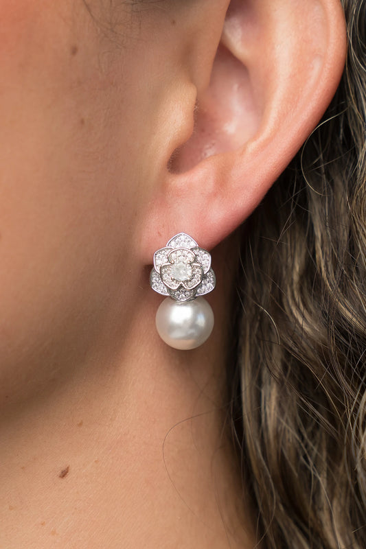 Helena Floral Pearl Drop Earrings in Silver with floral cubic zirconia studs and faux pearl drop.