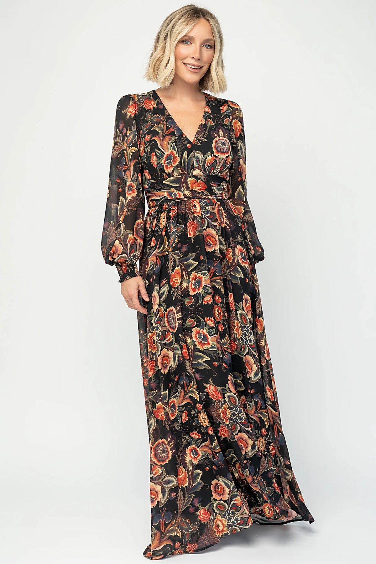 Hera Maxi Dress in Black Multi Print with deep V-neckline, long sleeves, gathered waist, and smocked back.