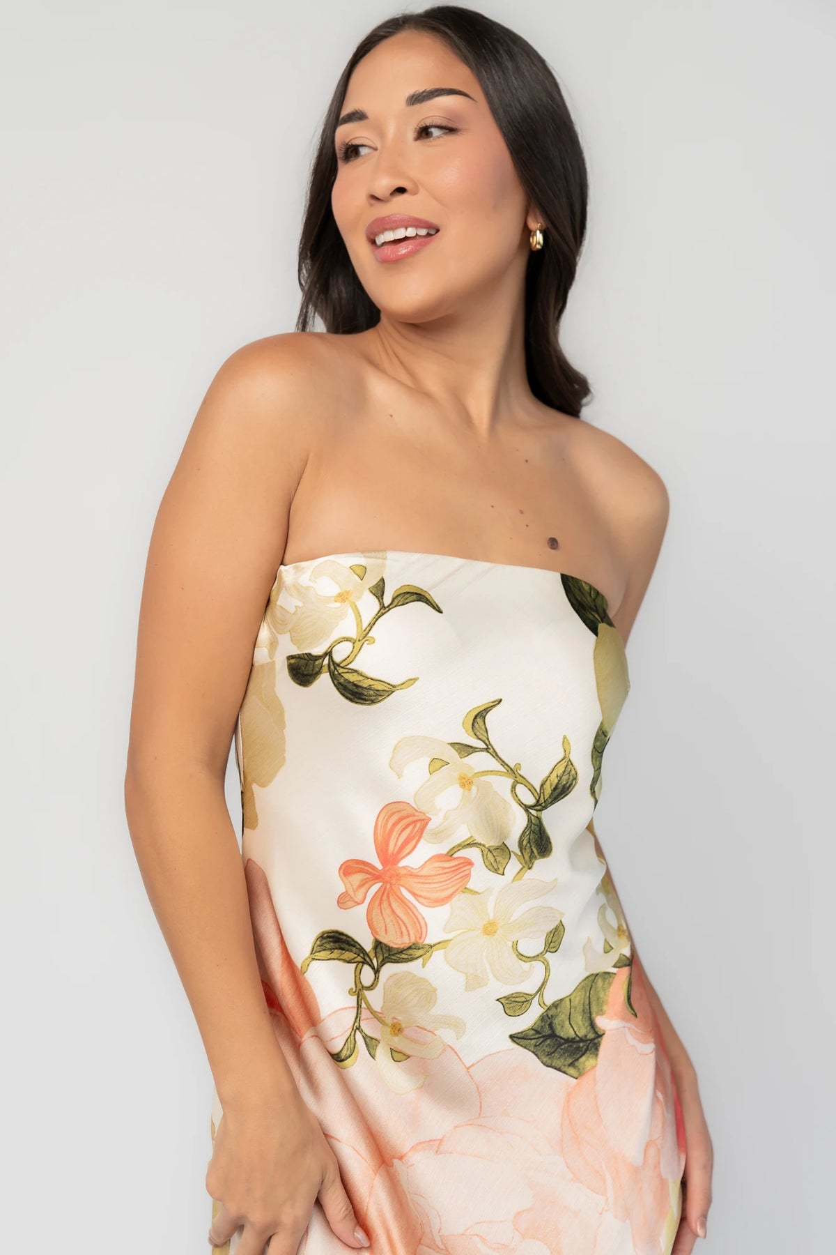 Hermosa Strapless Maxi Dress in Off White Multi Floral with strapless fitted bodice, fitted waist, and flowing maxi skirt.