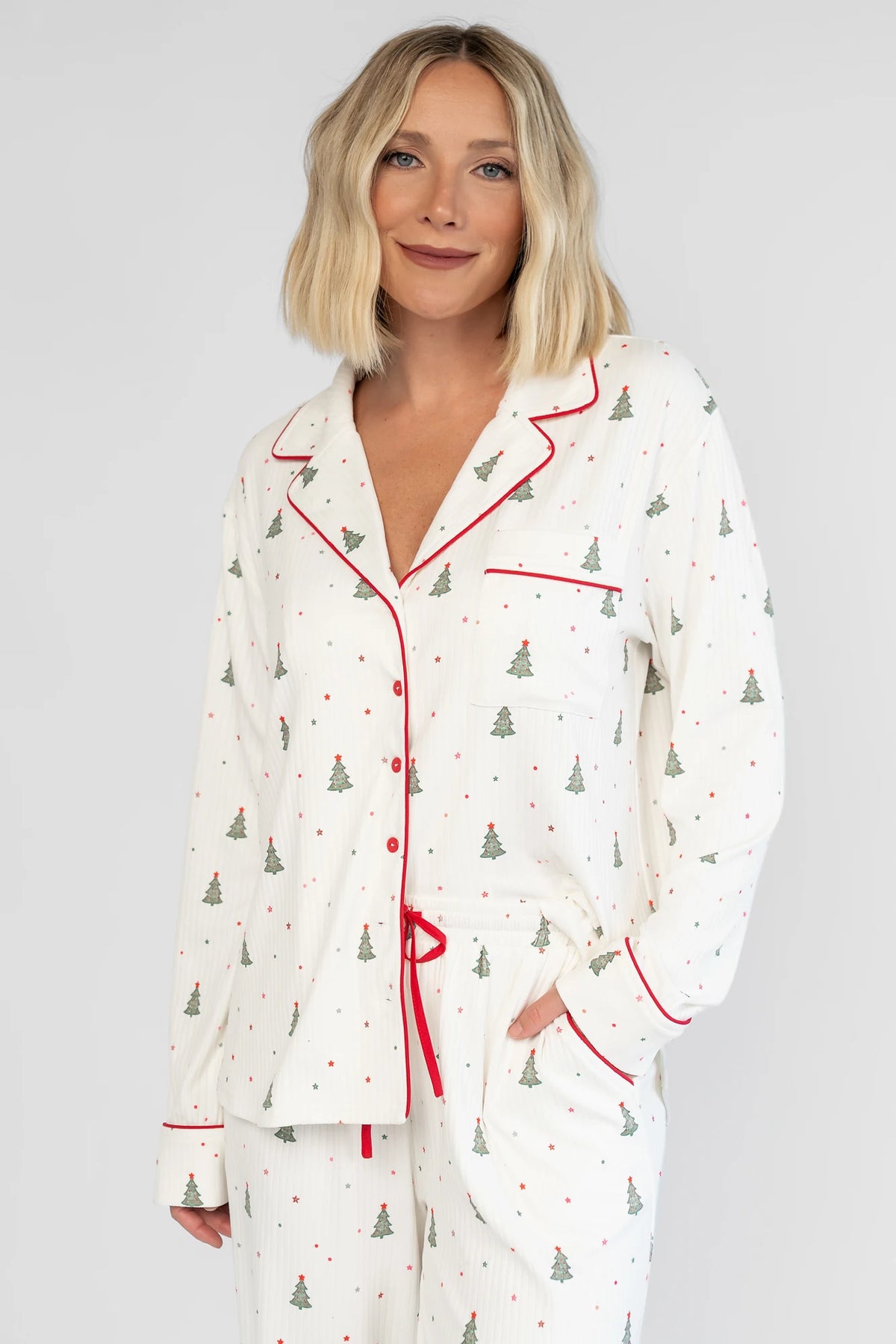 Holiday Cozy Rib Knit Pajamas in Ivory + Evergreen with an evergreen tree print, button-front top, and contrast red piping.