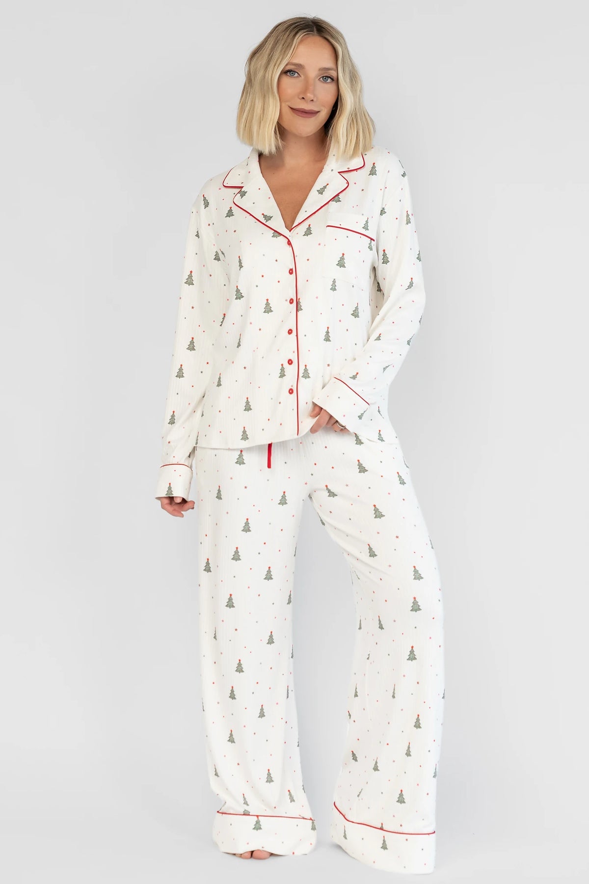Holiday Cozy Rib Knit Pajamas in Ivory + Evergreen with an evergreen tree print, button-front top, and contrast red piping.