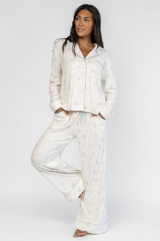 Holiday Cozy Rib Knit Pajamas in Ivory + Ice Blue with a snowflake print, button-front top, and contrast piping.