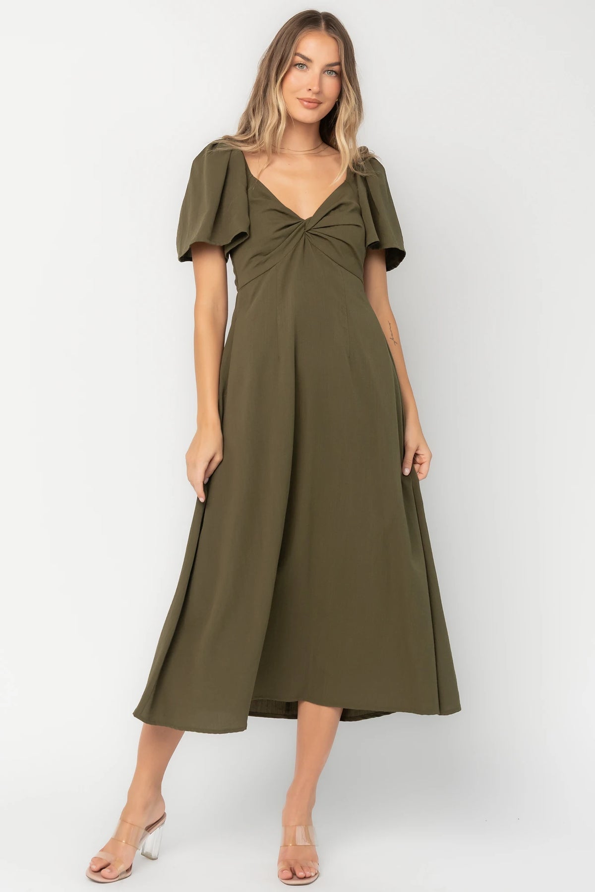 Indie Back Tie Dress in Olive with sweetheart neckline, butterfly sleeves, open tie-back, and side pockets.