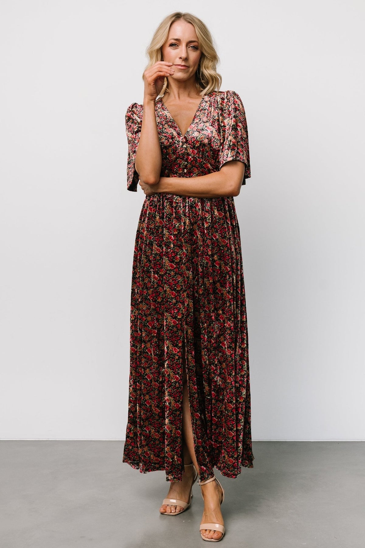 Detail of the left-leg slit and partially lined skirt on the Irina Velvet Maxi Dress in black multi floral, illustrating movement.