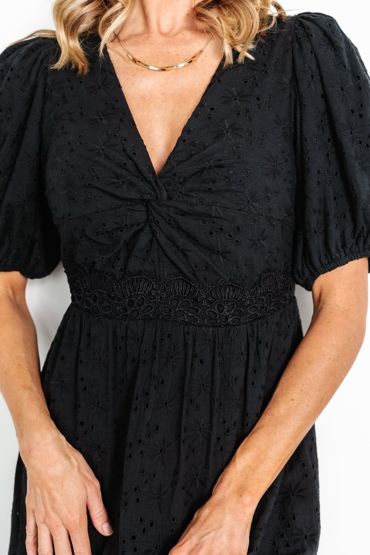 Back view showing elastic back waist and the single-tiered maxi skirt silhouette with lace detail at the tier.